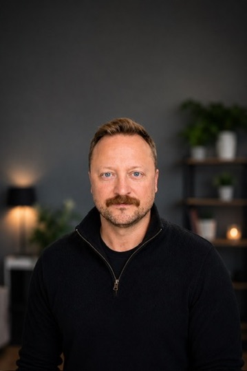Professional headshot of Kyle Poupore